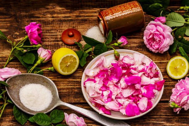 istock Ingredients for cooking rose petals jam. Sugar, lemon, fragrant flowers 1251355029