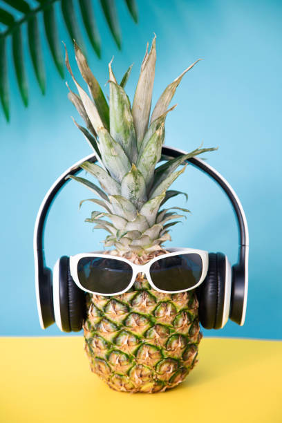 istock Pineapple with headphones and sunglasses 1251355288