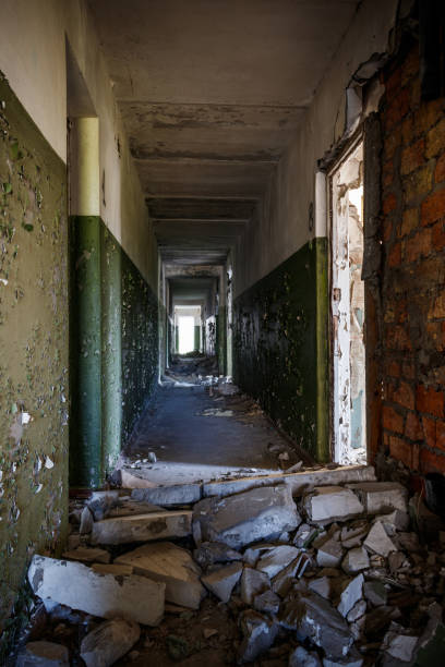 istock Long corridor of ruined abandoned house 1251355549