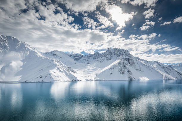 istock Mountain Lake in the Andes with snow 1251356528