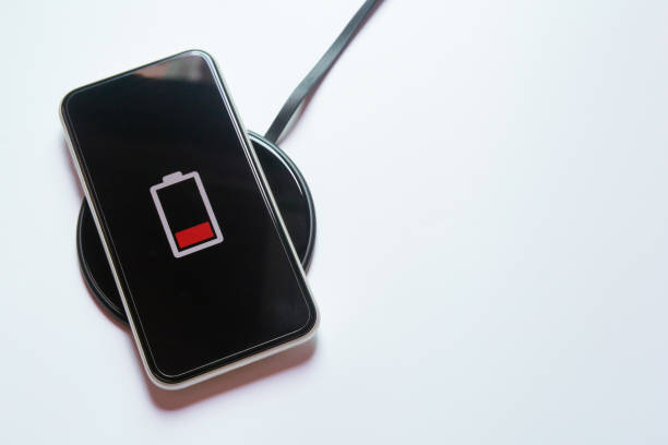 istock Smartphone charging on a wireless charger 1251356936
