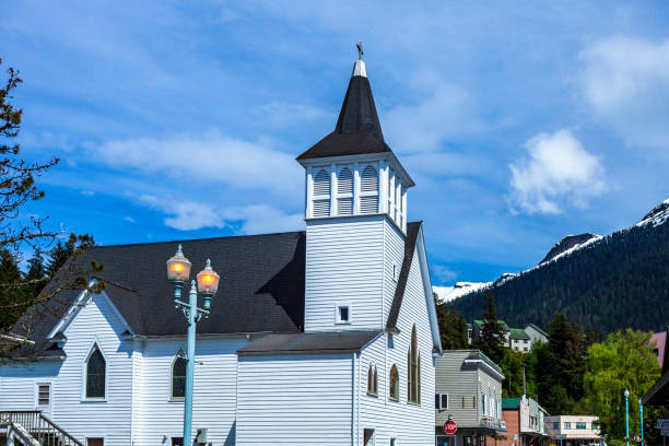 This beautiful white church welcomes you to the downtown's main street in Ketchikan, Alaska stock photo