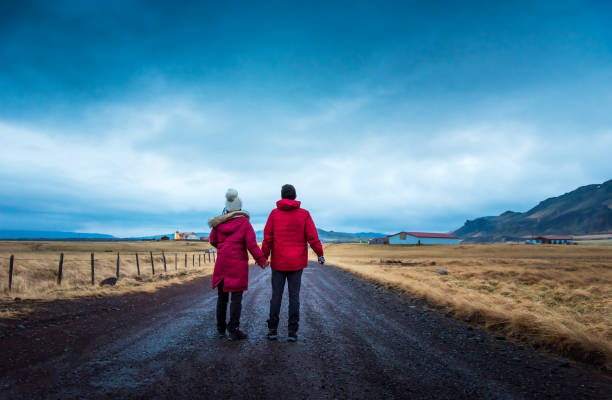 istock Couple on a rural road exploring Iceland 1251363896
