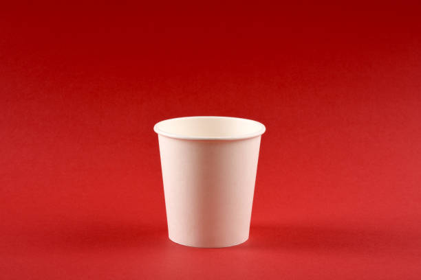 istock A paper coffee cup on red background with copy space 1251367954