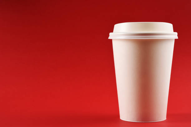istock A paper coffee cup on red background with copy space 1251368012