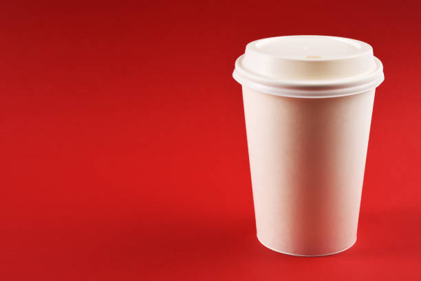 istock A paper coffee cup on red background 1251368665