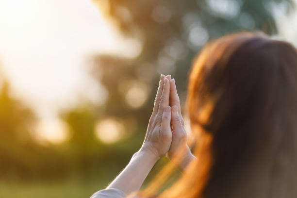 istock A woman prays . 1251369411