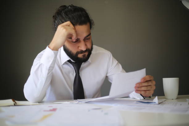 istock Reading bad news in letter 1251370937