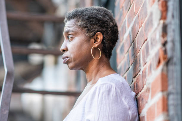 istock African American woman on fire escape 1251373504