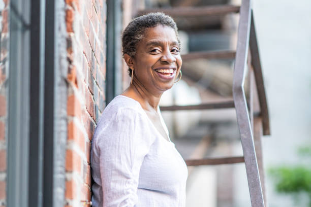 istock African American woman on fire escape 1251373507