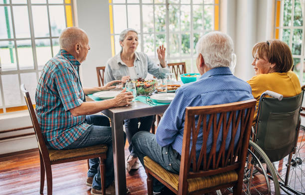istock Four senior people having dinner together 1251373929