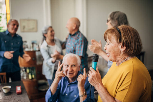 istock People having a karaoke party in nursing home 1251374623