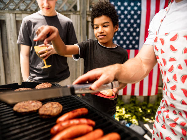 istock Burger line up at 4th July BBQ 1251374900