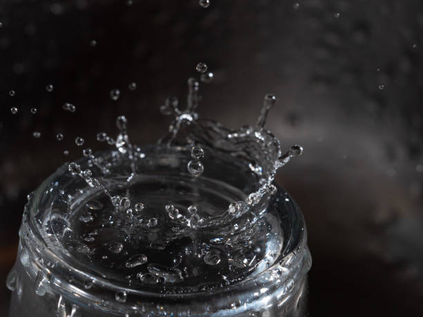 istock A drop of water falling into a glass 1251375288
