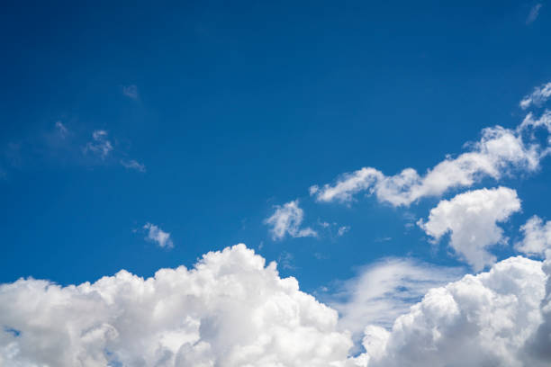 istock Blue summer sky with cumulus clouds in white 1251376486