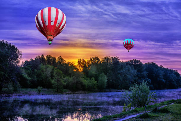 istock A beautiful sunrise over the river with a hot air baloons. 1251377363