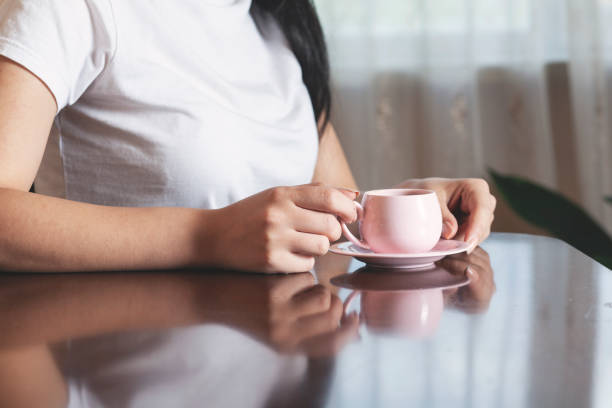istock woman hand cup of coffee 1251378658