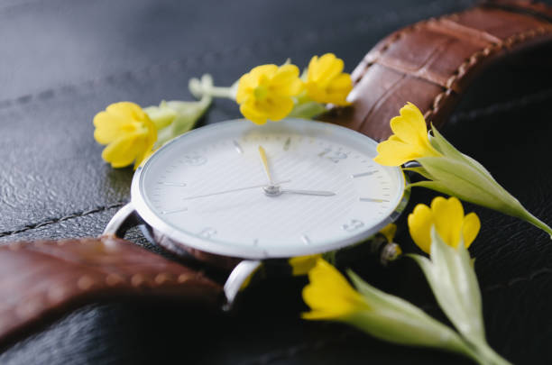 istock Watch with small yellow flowers 1251379208