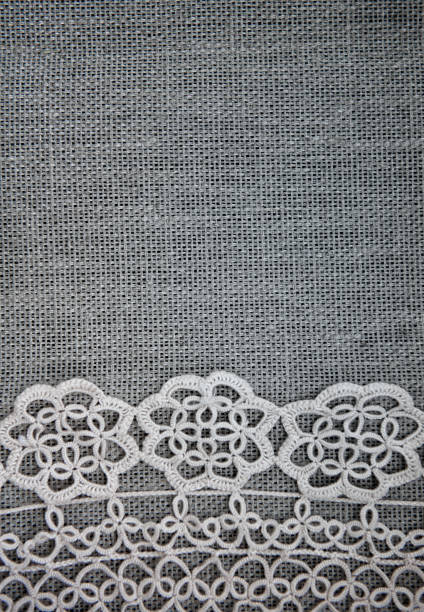 istock Vintage old lacy on the burlap fabric background 1251379449