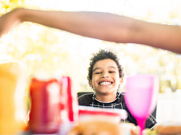 istock Young boy enjoying 4th July BBQ 1251382951