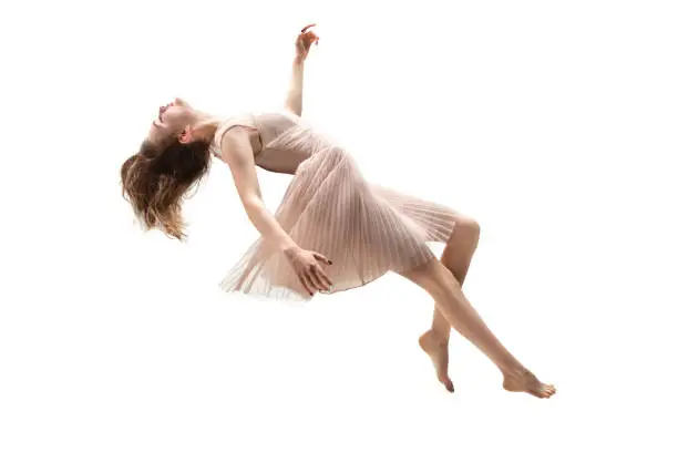 Photo of Mid-air beauty. Full length studio shot of attractive young woman hovering in air and keeping eyes closed