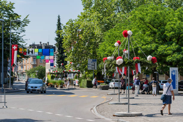 main street of brugg decorated with red and white paper flower on the 4th of july at jugendfest brugg 2019 - university graduation car student imagens e fotografias de stock