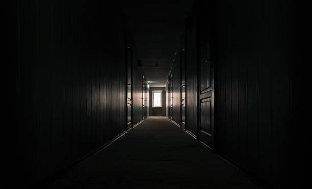 gloomy dark corridor of an empty hotel without people during quarantine