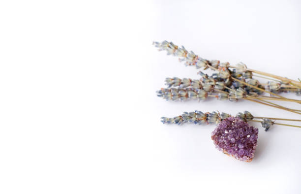 istock Amethyst  purple druse and dried lavender on a white background. Copy space 1251387523