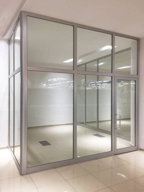 istock Empty modern office room interior with glass partition walls 1251390173
