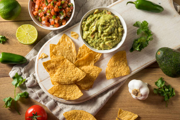 istock Homemade Tortillas Chips with Salsa and Guacamole 1251390221