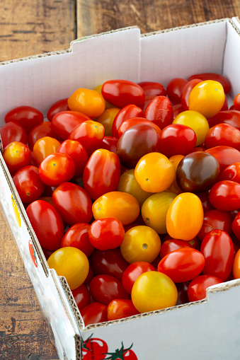 close-up of multi colored cherry tomatoes in box