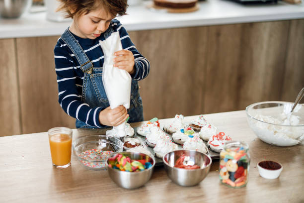 istock adorable little helper in kitchen. 1251393585