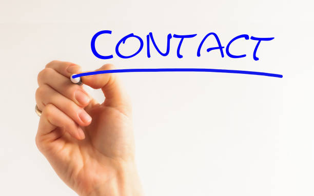 istock Hand writing Contact with blue marker on transparent wipe board. 1251395202
