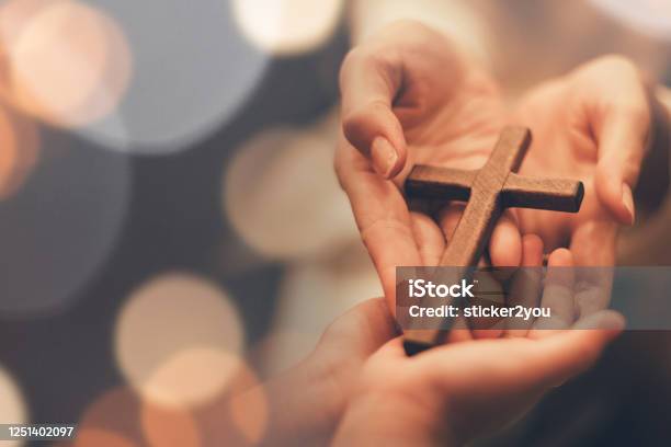 Womans Hand With Cross Concept Of Hope Faith Christianity Religion Church Online Stock Photo - Download Image Now