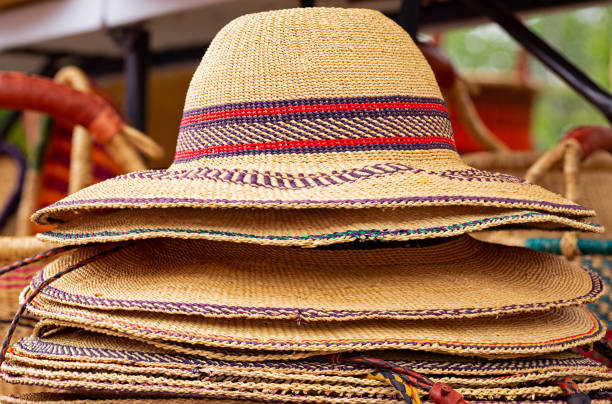istock Hand woven West African hats at an outdoor bazaar 1251403070
