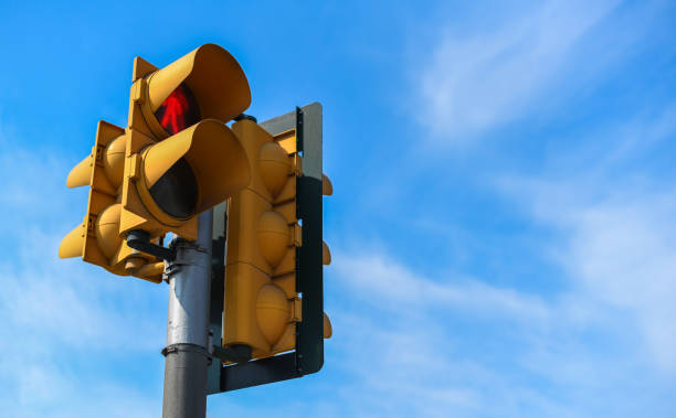 istock Yellow traffic lights against blue sky 1251403325