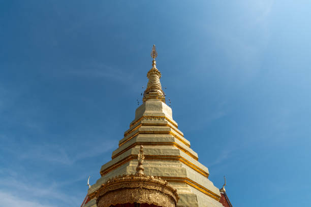 istock The golden pagoda with blue sky background. 1251407579