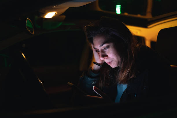 istock Upset young woman text messaging in her car 1251407697