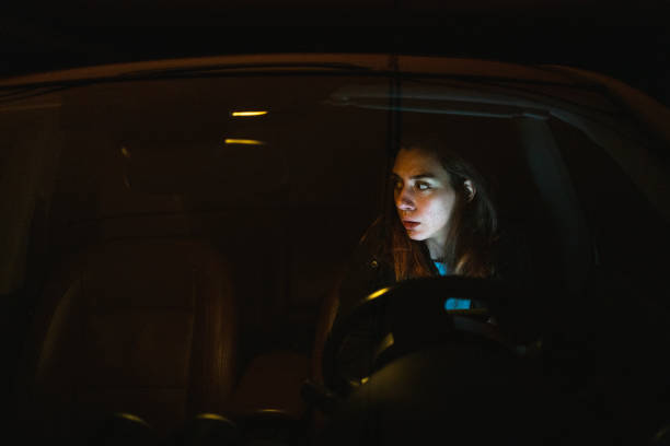 istock Upset young woman text messaging in her car 1251407714