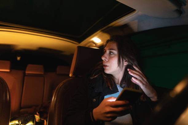 istock Upset young woman text messaging in her car 1251407715