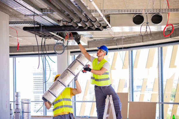Man setting up ventilation system indoors Worker making an HVAC air duct air duct photos stock pictures, royalty-free photos & images