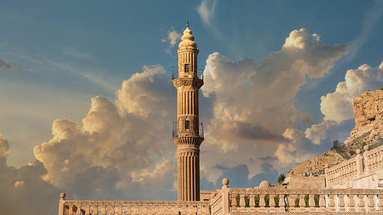 Mardin, Turkey - January 2020: Minaret of Ulu Cami, also known as Great mosque of Mardin with dramatic sky