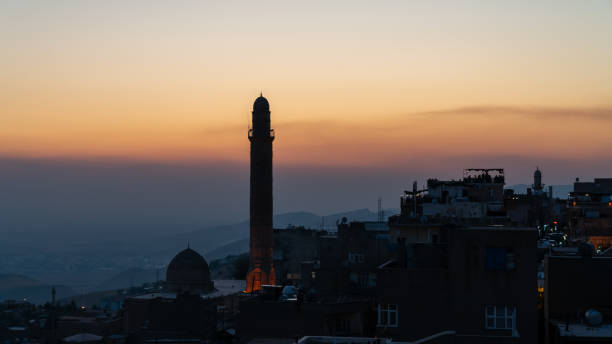 Mardin landscape at sunset with minaret of Ulu Cami, also known as Great mosque of Mardin, Turkey Mardin, Turkey - January 2020: Mardin cityscape at sunset with minaret of Ulu Cami, also known as Great mosque of Mardin ulu camii stock pictures, royalty-free photos & images