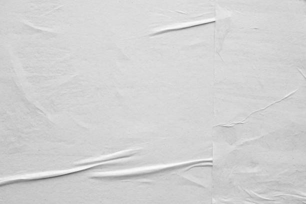 istock Blank white crumpled and creased paper poster texture background 1251415278