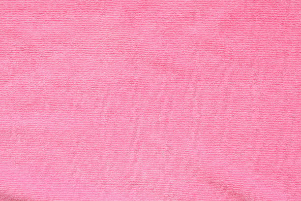 istock Pink towel fabric texture surface close up background 1251415353