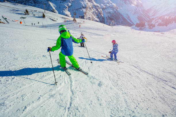 istock Ski kid class racing down in morning light 1251415494
