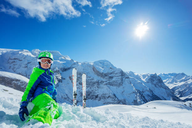 istock Little boy having fun skiing in Alpine mountains 1251415512