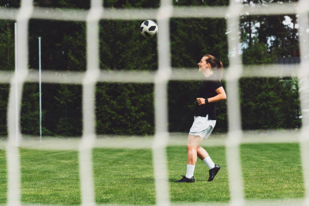 istock Caucasian woman playing soccer 1251415567