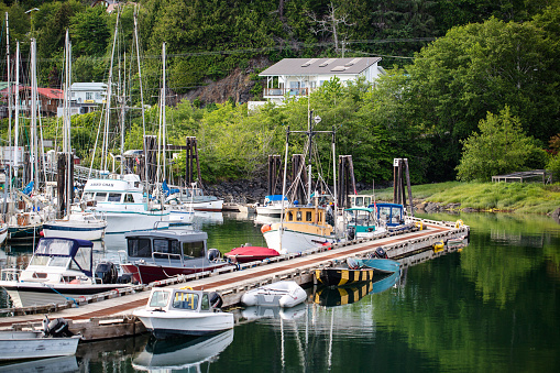 Village of Queen Charlotte - June 13, 2020. Recreational and fishing boats are docked at the main marina in the Village of Queen Charlotte, Haida Gwaii.