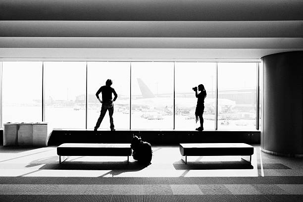 Female photographer and male model in Narita Airport Tokyo JAPAN